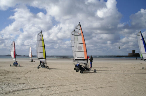 Blokarting on beach near Rocco Tower in Jersey